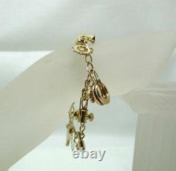 1970's Vintage 9 carat Gold Charm Bracelet With Nine Charms