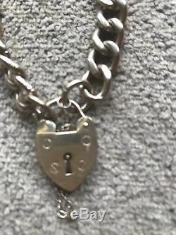 9 Ct Gold, Curb Chain Bracelet With Heart Padlock, 35.2 Grammes. Hallmarked