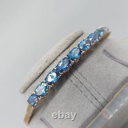 9ct 375 Gold Bangle with 11 Blue Stones, London Assay, BJB, 11g, 6.5cm Wide