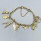 9ct 375 Solid Yellow Gold Charm Bracelet Hallmarked With 7 9ct Charms #329