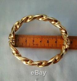 9ct 375 twisted 9ct gold bangle hinged with safety clip