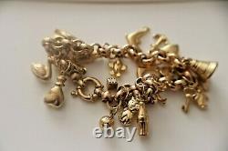 9ct GOLD CHARM BRACELET WITH APPROXIMATELY 23 CHARMS 17.1gms