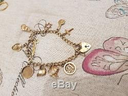 9ct Gold Charm Bracelet With Lots Of Charms. See Pics