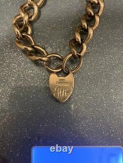 9ct Gold Curb Chain Bracelet With Heart Shaped Clasp. Weight 18.8gms