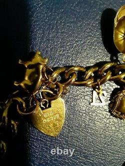 9ct Gold Vintage Charm Bracelet with 19 charms and safety chain 40grams