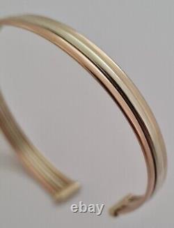 9ct Gold multi tone gold torque bangle. 6.1 grams