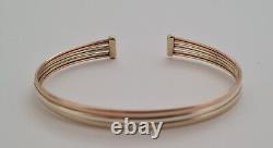 9ct Gold multi tone gold torque bangle. 6.1 grams