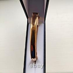 9ct Rose Gold buckle hinged bangle hallmarked Chester 1914 8.4 grams with safety