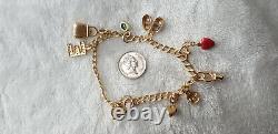 9ct YELLOW GOLD CHARM BRACELET 8 CHARMS STAMPED 375 11.7 g