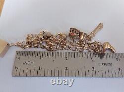 9ct gold charm bracelet +9 charms all hallmarked 21.16 grams