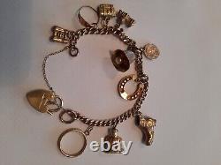 9ct gold charm bracelet with 10 9ct gold charms used