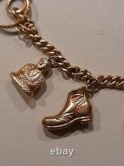 9ct gold charm bracelet with 10 9ct gold charms used