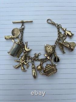 9ct gold charm bracelet with 21 charms