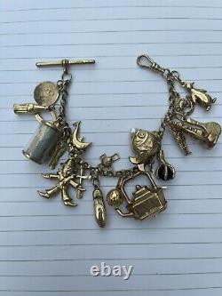 9ct gold charm bracelet with 21 charms