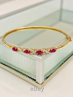 9ct gold diamond & ruby crossover hinged bangle 6 cm wide 4.6 g hallmark