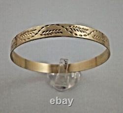 9ct gold heavy gauge slave bangle Weight 14.4 grams Width of the bangle 8mm