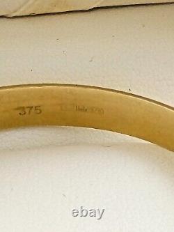 9ct gold heavy gauge slave bangle Weight 14.4 grams Width of the bangle 8mm