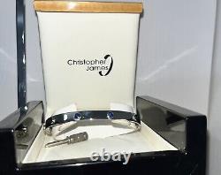 9ct white gold screw bangle with X2 sapphires 19cm