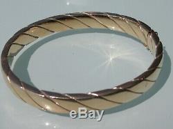 9ct yellow Gold bangle weight approximately 18g hinged with safety catch