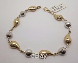 9ct yellow and white gold 7 3/4'' fancy link bracelet measuring a width of 7 mm