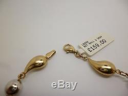 9ct yellow and white gold 7 3/4'' fancy link bracelet measuring a width of 7 mm