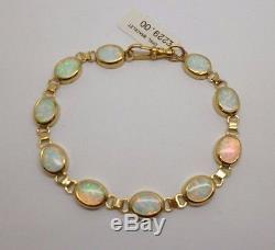 9ct yellow gold 10 stone oval cut white opal 7.5 bracelet with swivel clasp