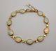 9ct Yellow Gold 10 Stone Oval Cut White Opal 7.5 Bracelet With Swivel Clasp
