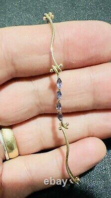9ct yellow gold S shaped links bracelet with 12 Amethyst gems. 7 long, 3.91gr