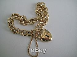 9ct yellow gold classic charm bracelet with heart padlock