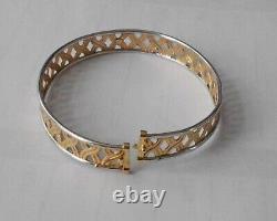 9ct yellowithwhite bangle with s/catch