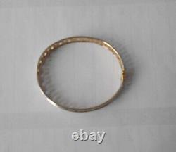 9ct yellowithwhite bangle with s/catch