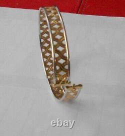 9ct yellowithwhite bangle with s/catch