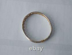 9ct yellowithwhite bangle with s/catch