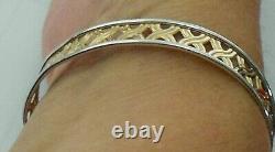 9ct yellowithwhite bangle with s/catch