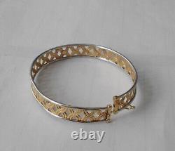9ct yellowithwhite bangle with s/catch