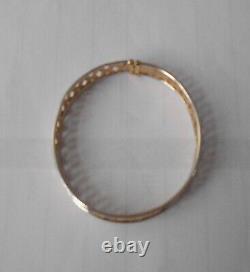 9ct yellowithwhite bangle with s/catch