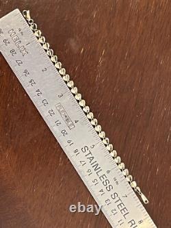 A Beautiful 9ct Gold Heart Bracelet