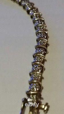 A Beautiful piece of jewellery. A 9ct Gold Diamond Tennis Bracelet. 7.5 inches