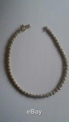 A Beautiful piece of jewellery. A 9ct Gold Diamond Tennis Bracelet. 7.5 inches