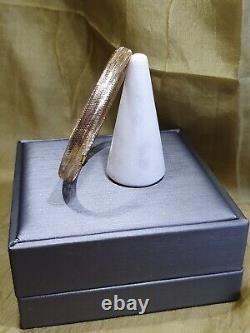 From The Italian AtelierHouse Of Frederico, 9ct gold bangle, Gold with Memory