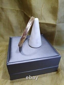 From The Italian AtelierHouse Of Frederico, 9ct gold bangle, Gold with Memory