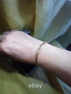 From The Italian AtelierHouse Of Frederico, 9ct gold bangle, Gold with Memory