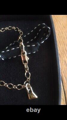 Genuine links of london solid 9ct gold braclet with 18ct tigers eye Pendant