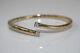 Hallmarked 9ct Gold Sprung Hinged Crossover Bangle With Clear Stones