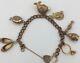 Hallmarked 9ct Gold Bracelet & Seven Charms. Weight Approx. 32.5g