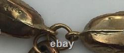 Hallmarked 9ct gold bracelet & seven charms. Weight approx. 32.5g