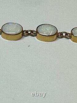 Handmade 9ct gold opal graduated bracelet. Hallmarkefd