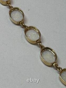Handmade 9ct gold opal graduated bracelet. Hallmarkefd