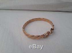 Heavy solid torque style 9ct gold bangle