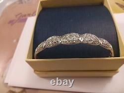 Ladies 9ct white gold hinged bangle/ bracelet with tiny chip diamonds pre owned